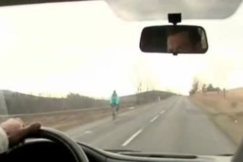 Three young dudes pokeing In A Car
