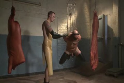 Muscled Hunk Suspended In The meat Locker