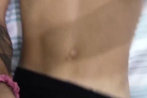 Tattooed darksome Skinned dilettante Sticks fake penis On Wall To Play