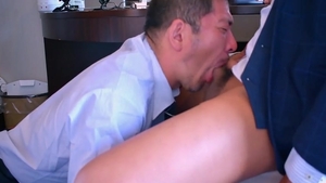 Suited Japanese men In Hotel Room