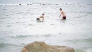 In Each Other's Arms On The Beach
