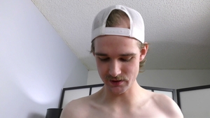 Playfully wears hat while getting tugged tight